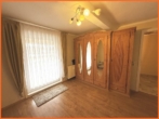 Gästezimmer - VERKAUFT 4 Zimmer-Maisonette mit Terrassen, Garten und Finanzierungshilfe durch gut vermieteten Laden.