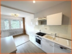 moderne offene Küche - Ihr kleines Wohnparadies – Gepflegte 2-Zimmerwohnung in ruhiger Aussichtslage und sep. Garage!