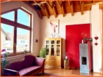 Wohnzimmer mit Ofen - Traumhafte Winzenheimer 4-Zimmer-Wohnung, Terrasse, Garten plus Gästeappartement!